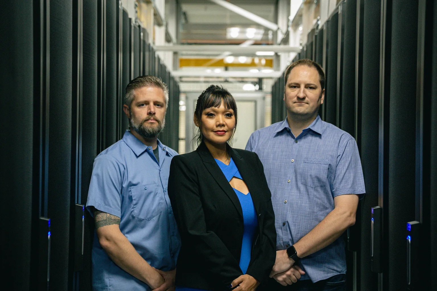 The Opus Interactive leadership team in a data center aisle.